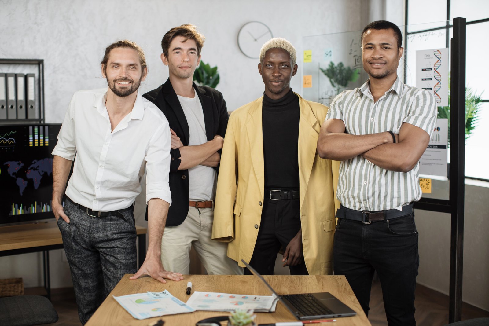 Multi ethnic brokers spending time for examining trade market.